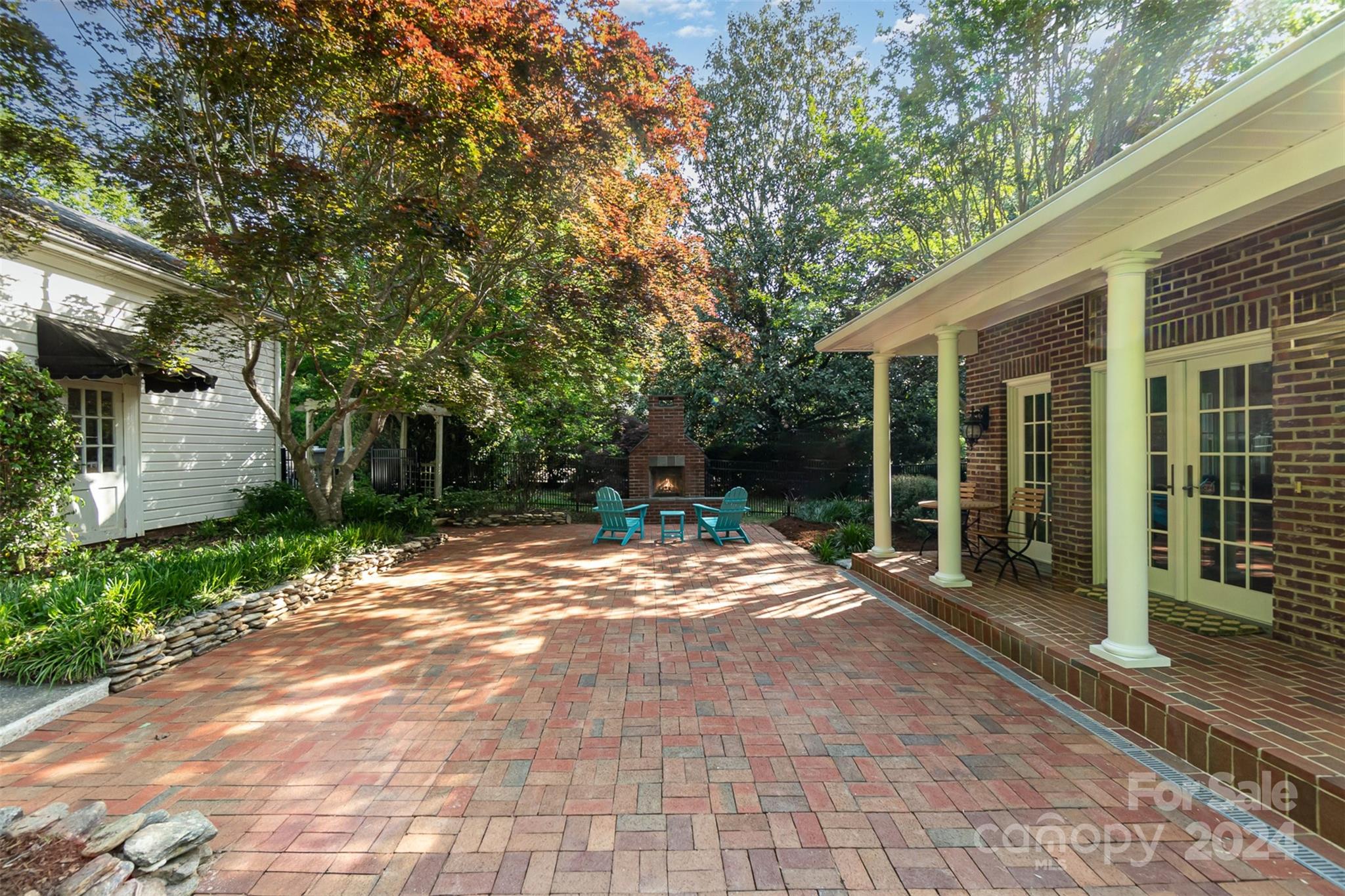 1900 South Wendover Road Charlotte, NC 28211 - Photo 30 of 38 a view of backyard with large trees and wooden fence
