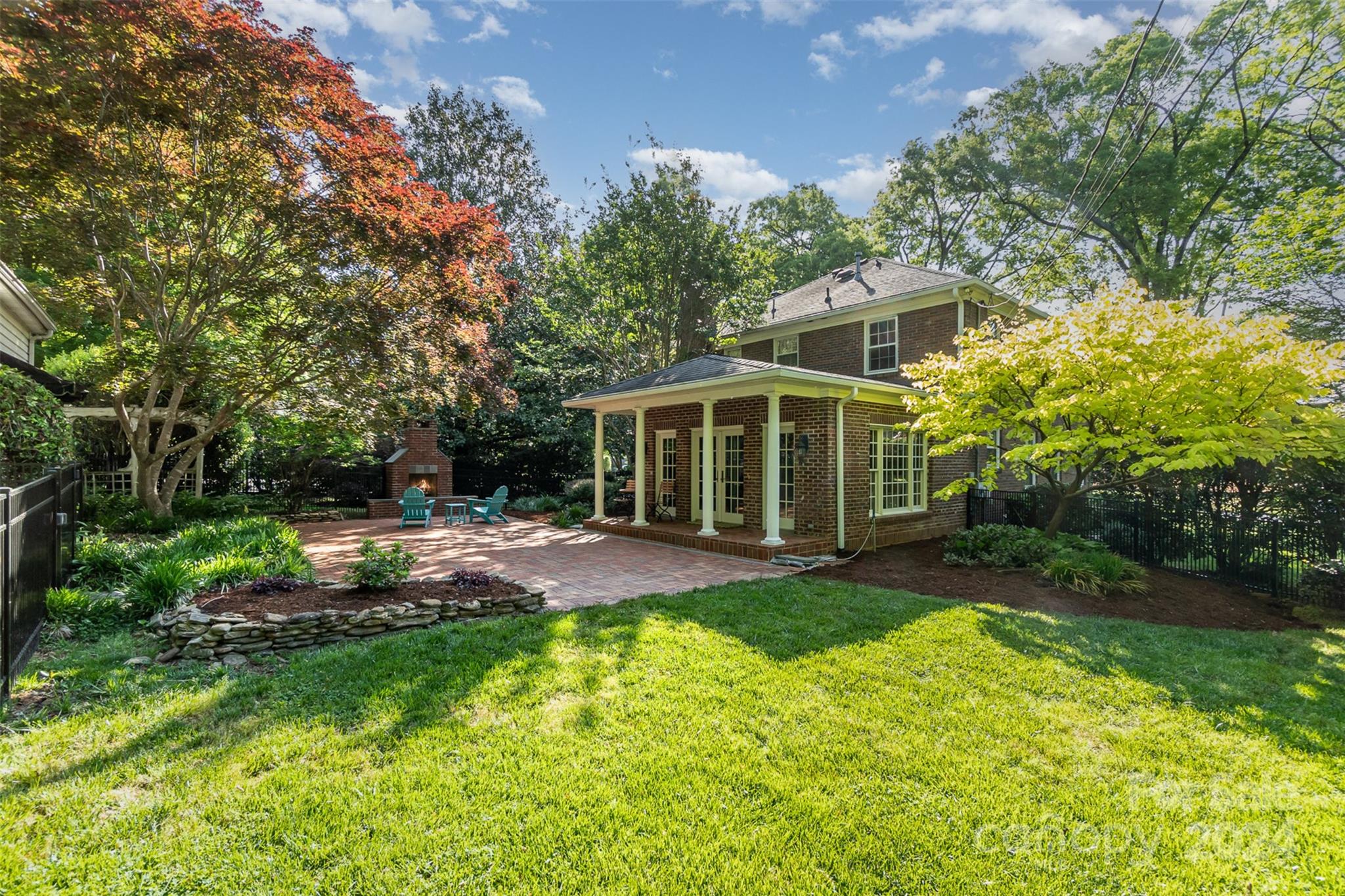 1900 South Wendover Road Charlotte, NC 28211 - Photo 31 of 38 a view of a house with backyard and sitting area