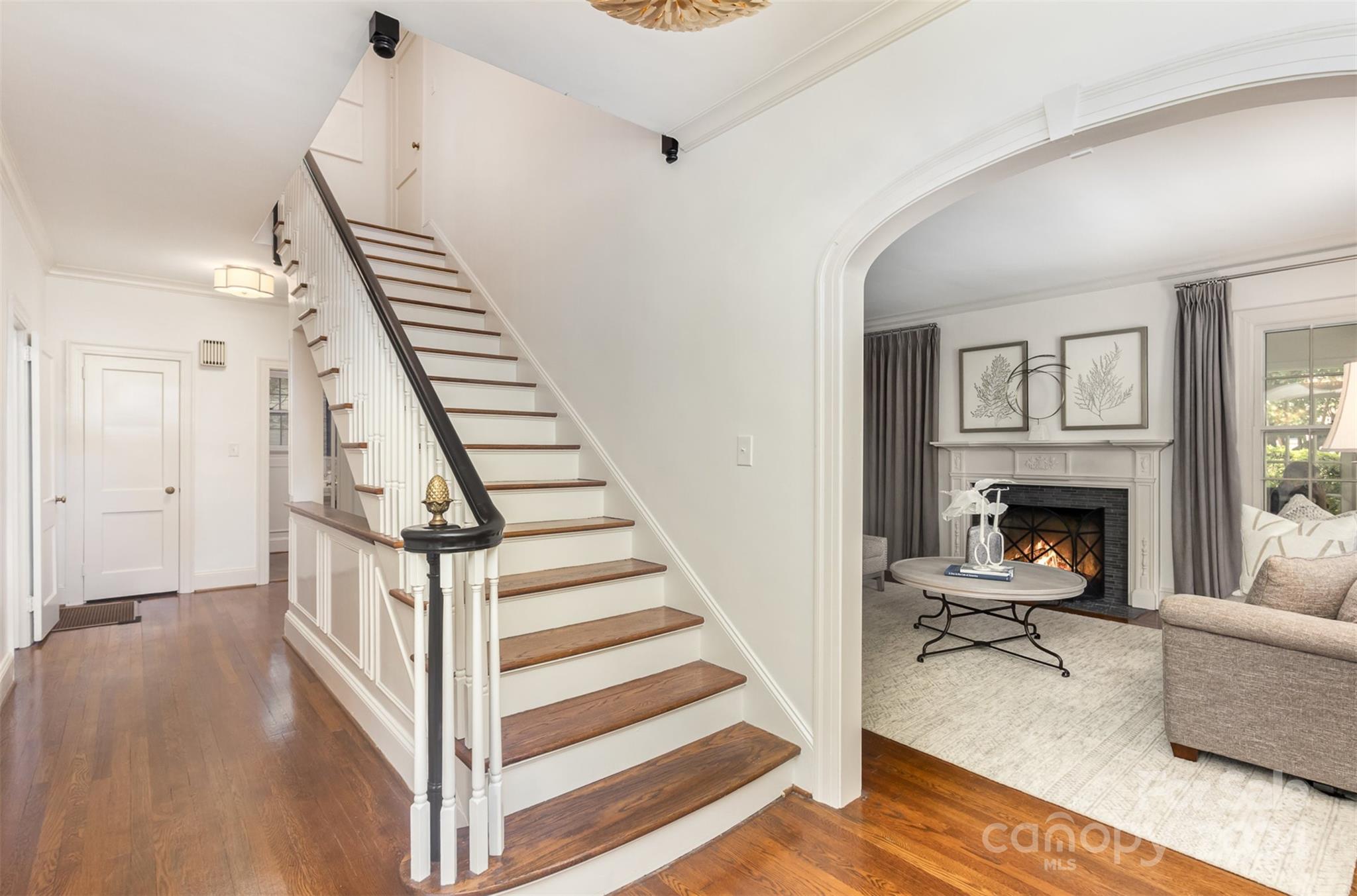 1900 South Wendover Road Charlotte, NC 28211 - Photo 4 of 38 a view of a livingroom with furniture and a fireplace