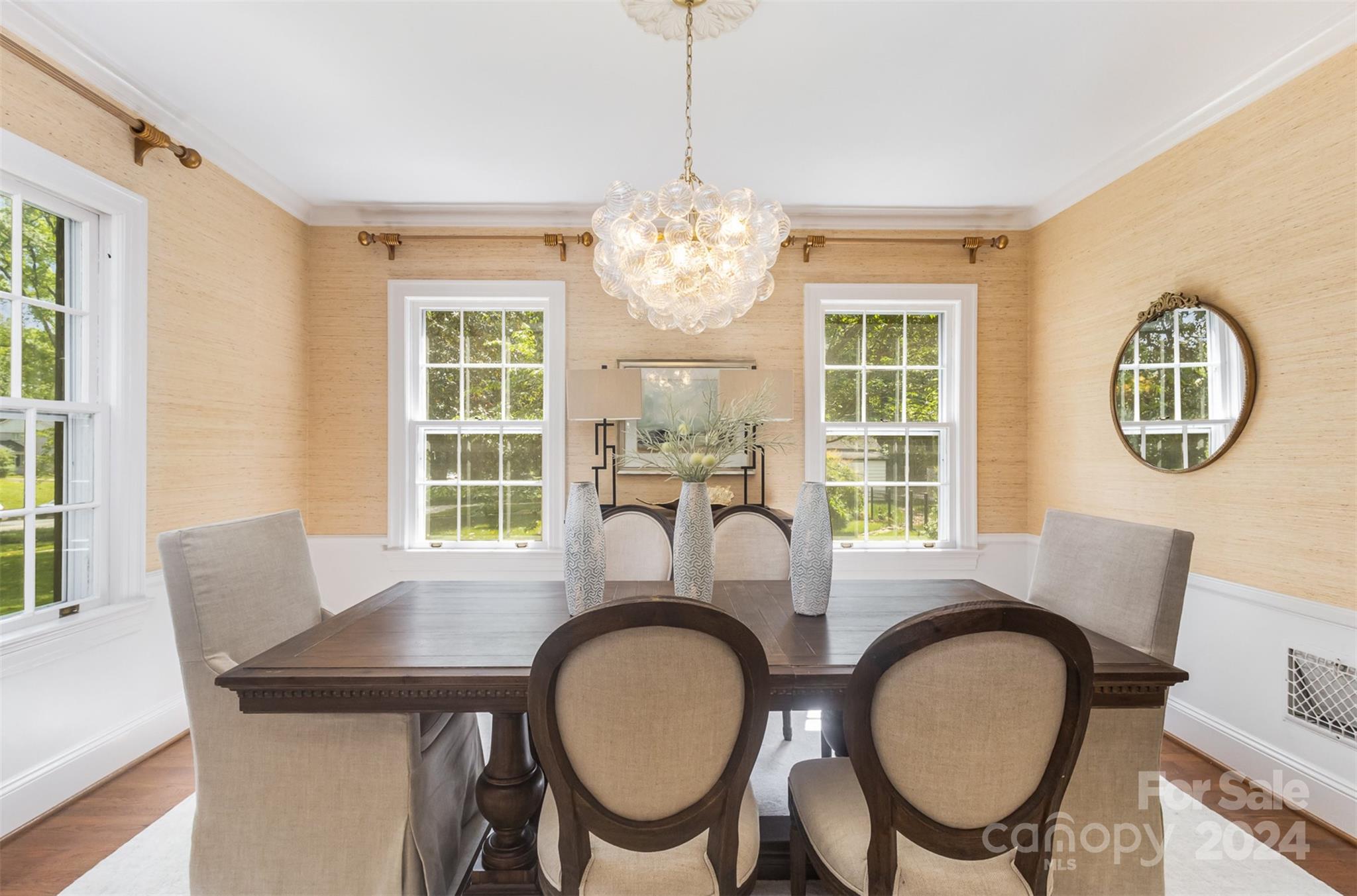 1900 South Wendover Road Charlotte, NC 28211 - Photo 8 of 38 a dining room with furniture a window and a chandelier