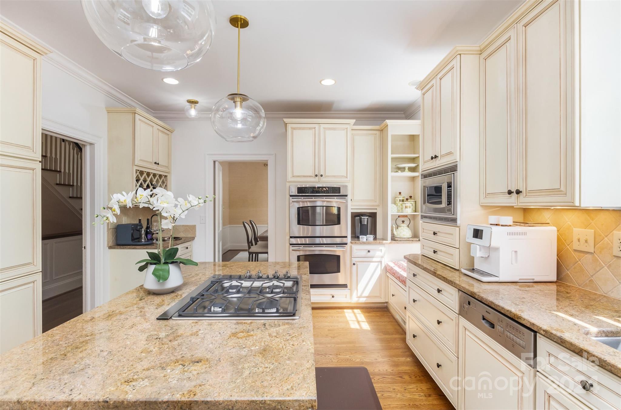 1900 South Wendover Road Charlotte, NC 28211 - Photo 10 of 38 a large kitchen with stainless steel appliances granite countertop a stove a sink dishwasher and a refrigerator with white cabinets