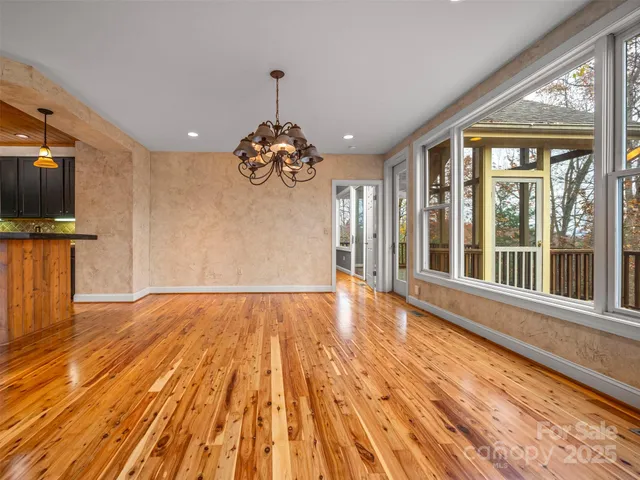 a view of a room with wooden floor and balcony