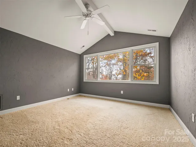 a view of a bedroom from a hallway