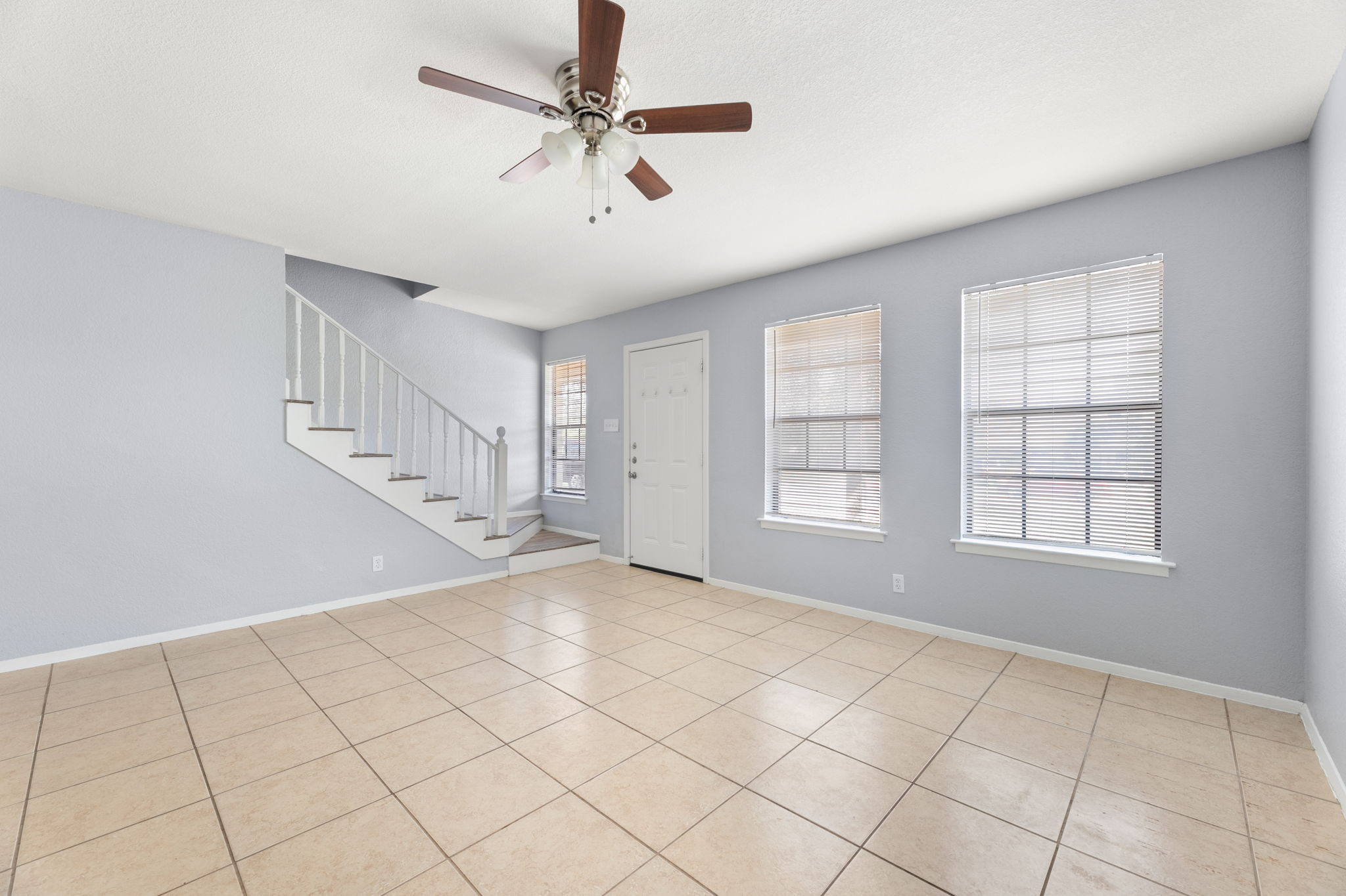 3802 Foust Trail, Unit A Georgetown, TX 78628 - Photo 5 of 34 The bright tiled floor and generous natural light create an inviting atmosphere in this versatile space.
