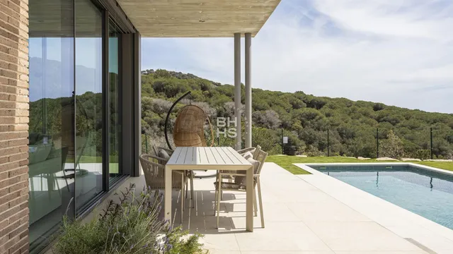 a view of a swimming pool with a patio