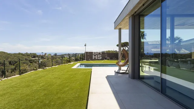 a view of swimming pool with a table and chairs