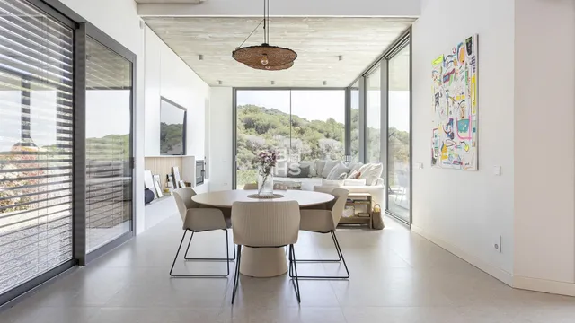 a view of a dining room with furniture window and outside view