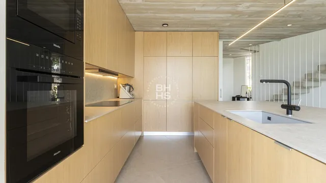 a bathroom with a double vanity sink a mirror and shower
