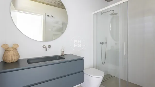 a bathroom with a toilet and a sink