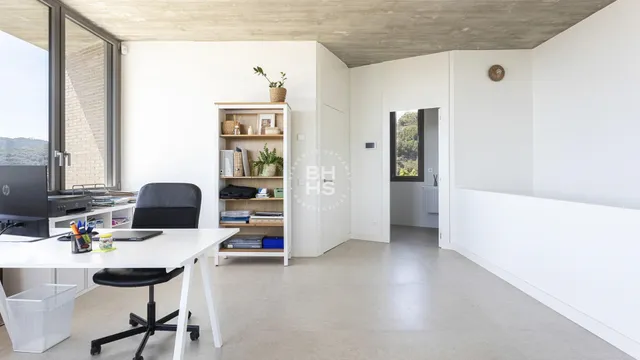 a workspace with furniture and window