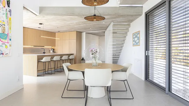 a dining room with furniture and window