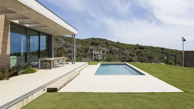 a view of swimming pool with a patio