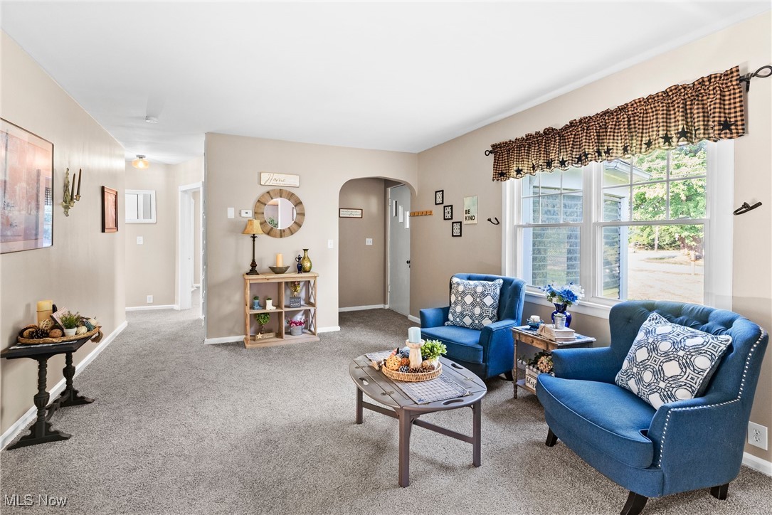 540 Park Road Painesville, OH 44077 - Photo 5 of 34 Carpeted living room with arched walkways and baseboards