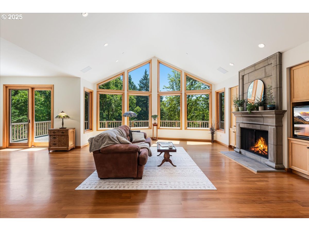 22500 Northwest Pihl Road Banks, OR 97106 - Photo 14 of 47 a living room with furniture large window and a fireplace