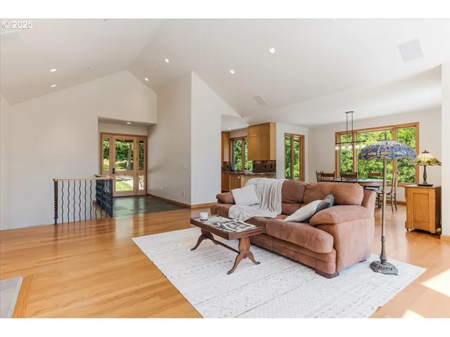 a dining room with furniture window and wooden floor