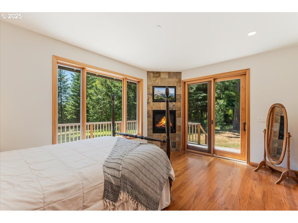 22500 Northwest Pihl Road Banks, OR 97106 - Photo 36 of 47 a bed sitting in a bedroom next to a large window