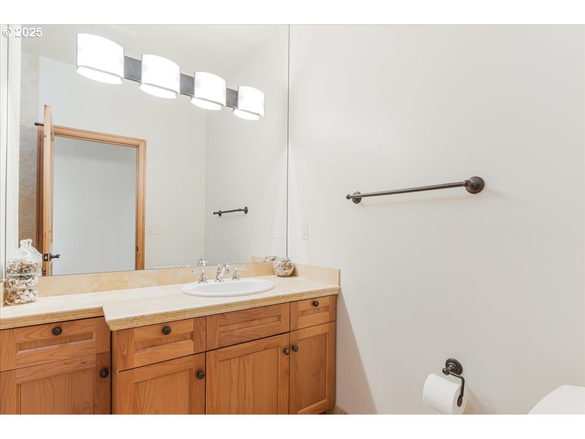 22500 Northwest Pihl Road Banks, OR 97106 - Photo 41 of 47 a bathroom with a sink and mirror