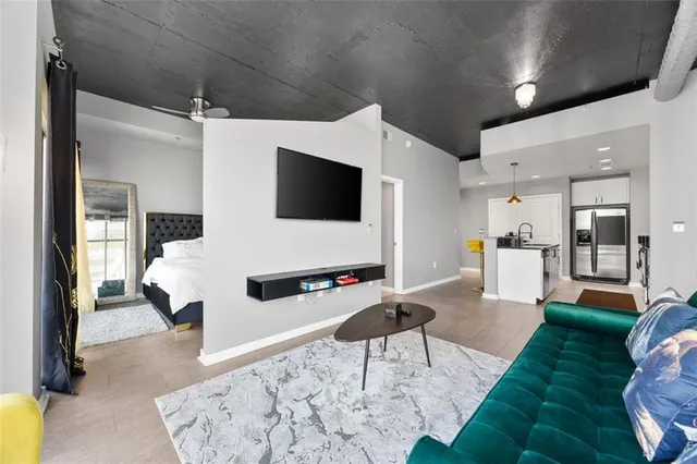 a living room with furniture and a flat screen tv