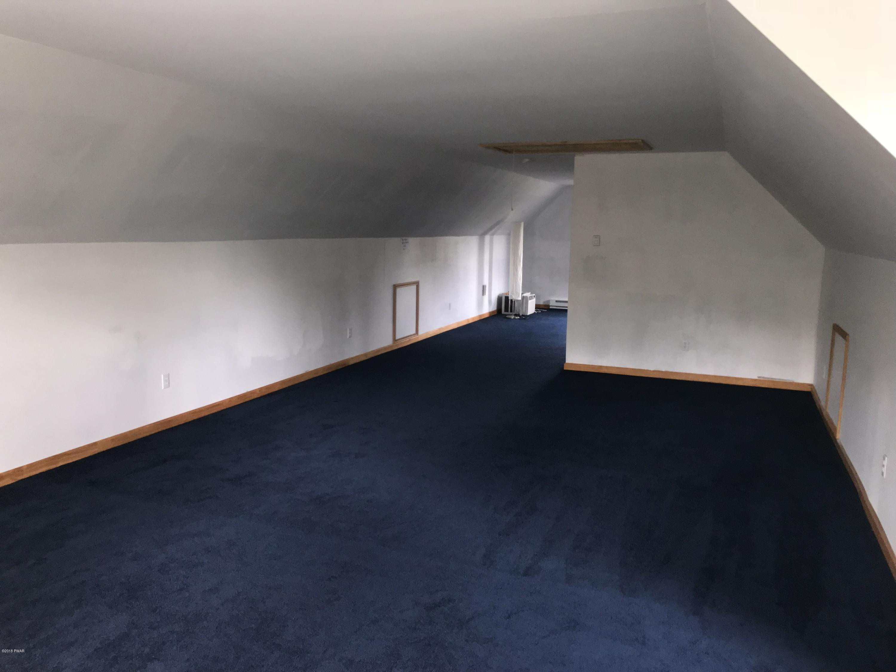 232 Maple Ridge Drive Hawley, PA 18428 - Photo 25 of 44 a view of an empty room with a window