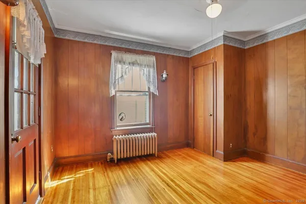 a view of front door with wooden floor