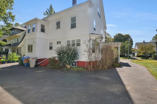 an aerial view of multiple houses with yard