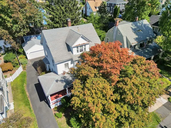 an aerial view of a house with a yard and garden