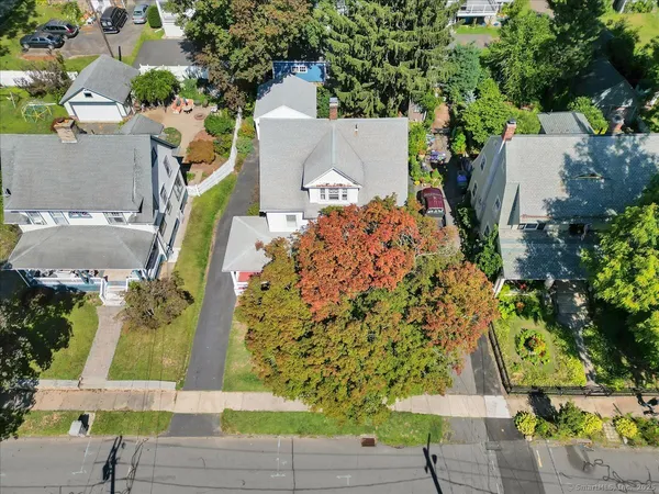 an aerial view of a house with a yard