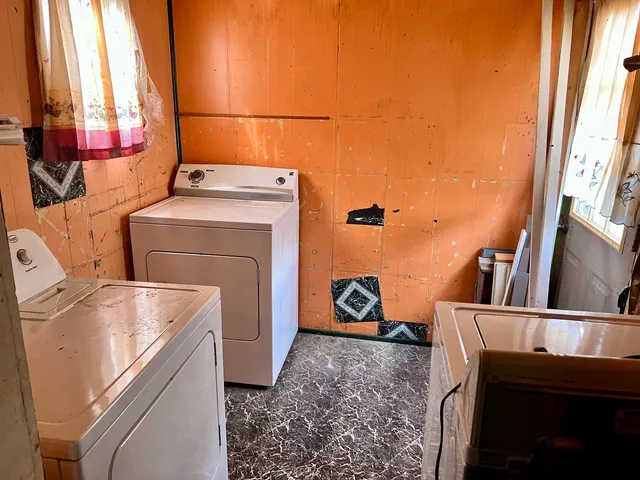 a utility room with dryer and washer