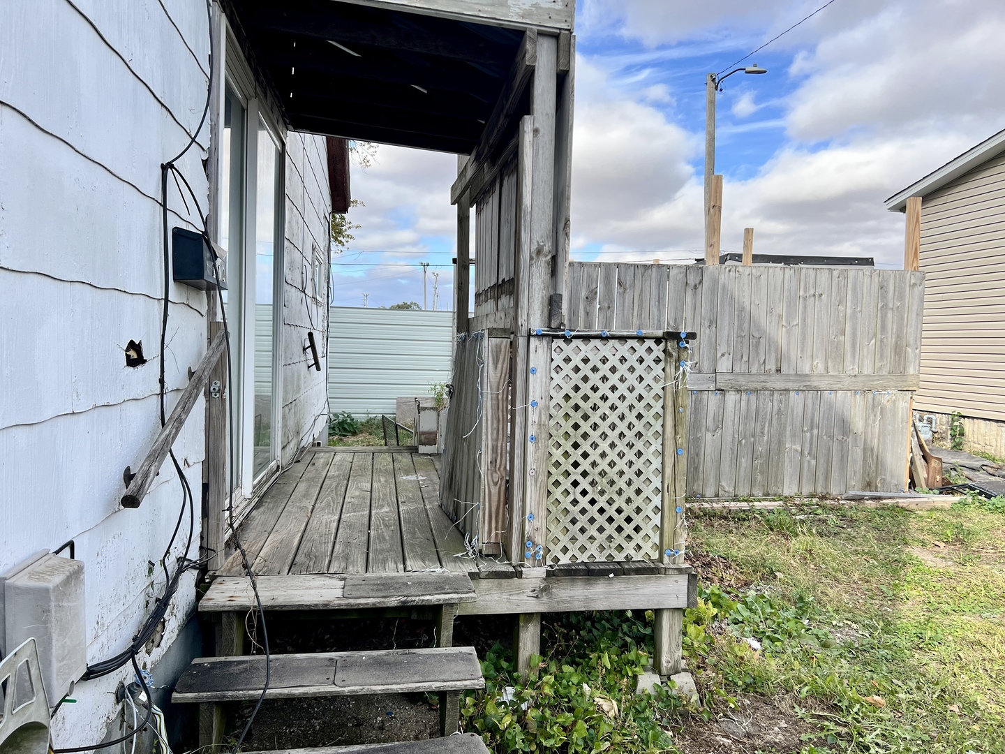 710 West Main Street Hoopeston, IL 60942 - Photo 3 of 25 a view of a balcony with wooden floor and bench