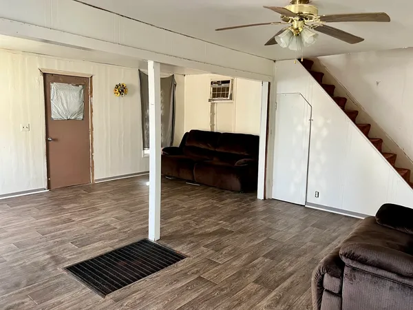 a view of livingroom with furniture and wooden floor