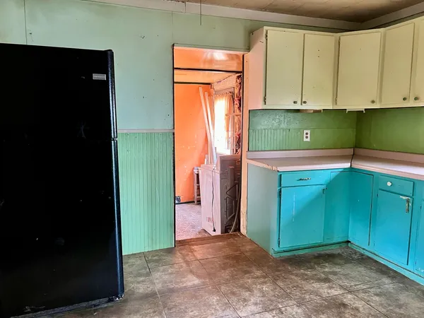 a view of a kitchen with washer and dryer