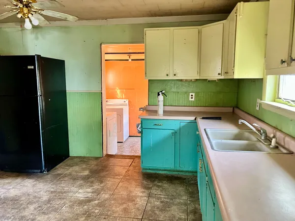 a kitchen with a sink and cabinets