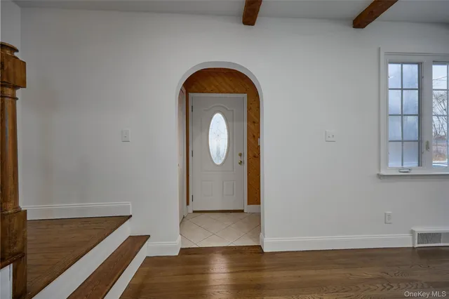 a view of entryway with wooden floor