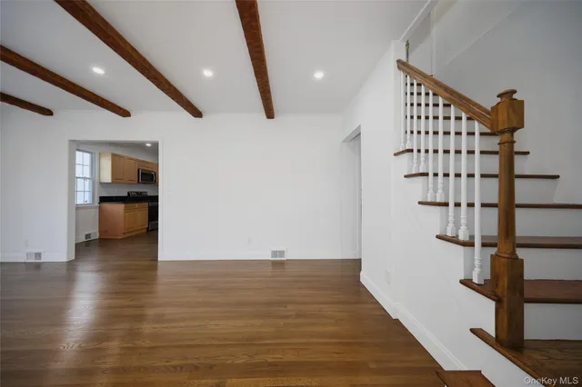 a view of entryway with wooden floor