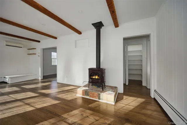 a living room with a fireplace furniture and a window