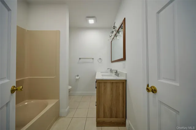 a bathroom with a shower and a sink