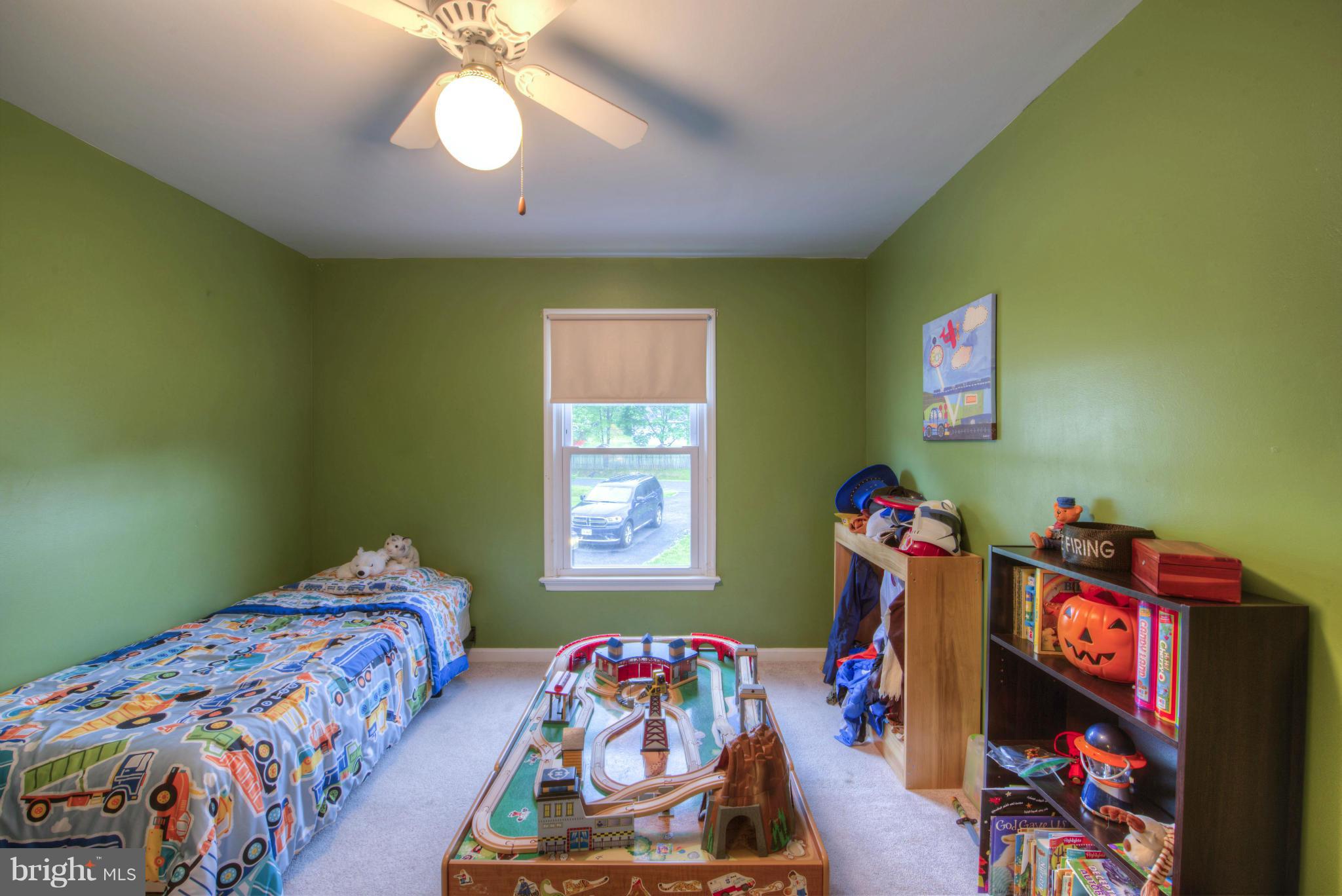 55 Buck Road Stafford, VA 22556 - Photo 12 of 19 a bedroom with furniture and a bed
