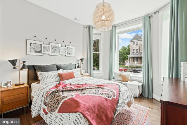 a bedroom with bed and a window