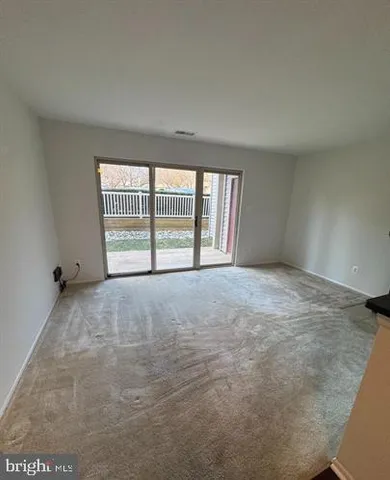 an empty room with a large window