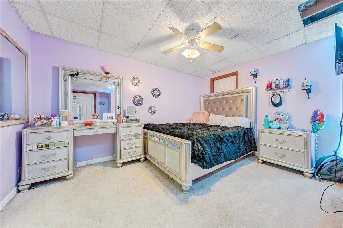 5497 Bethany Road Rustburg, VA 24588 - Photo 20 of 52 a bedroom with a bed and ceiling fan