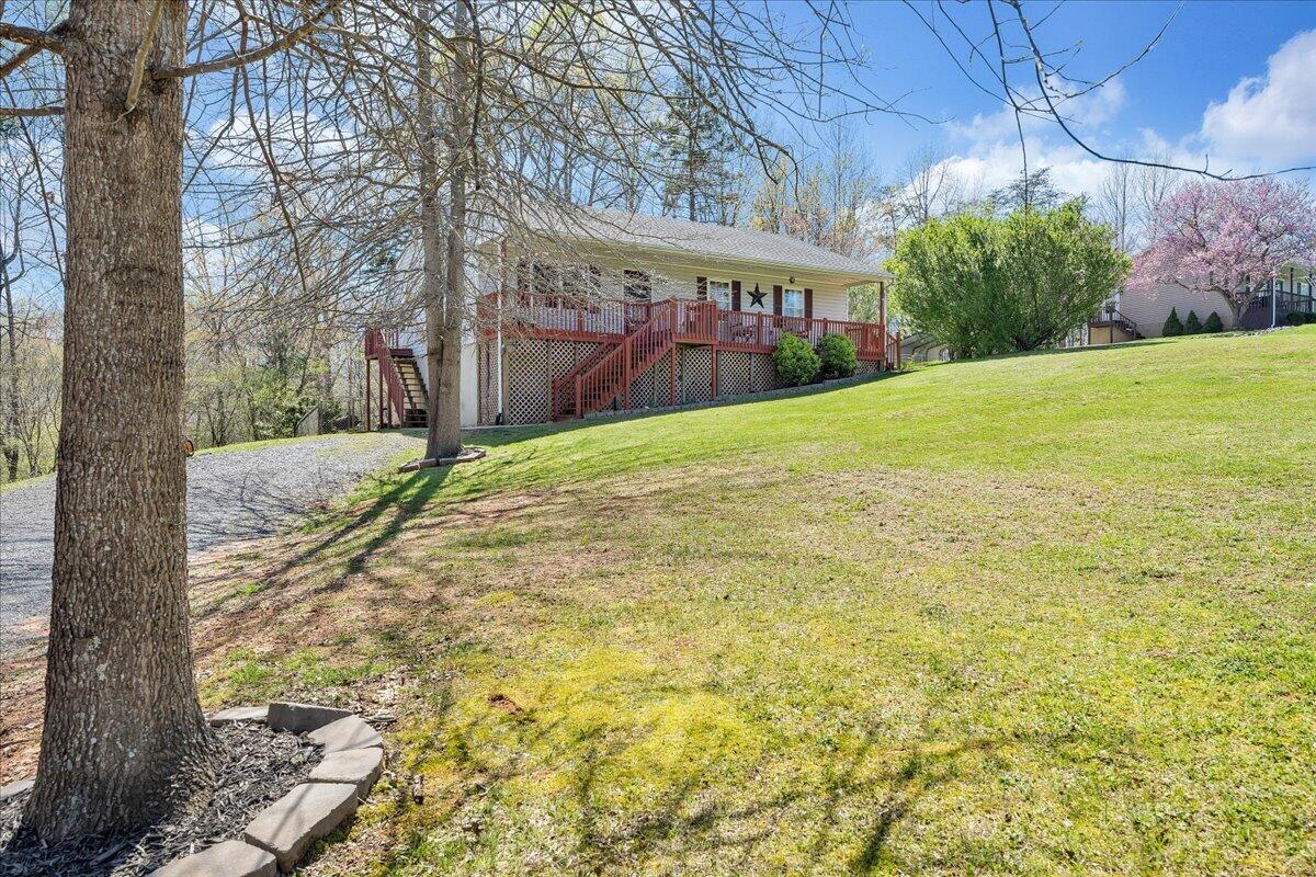 5497 Bethany Road Rustburg, VA 24588 - Photo 35 of 52 a view of a yard with plants and trees