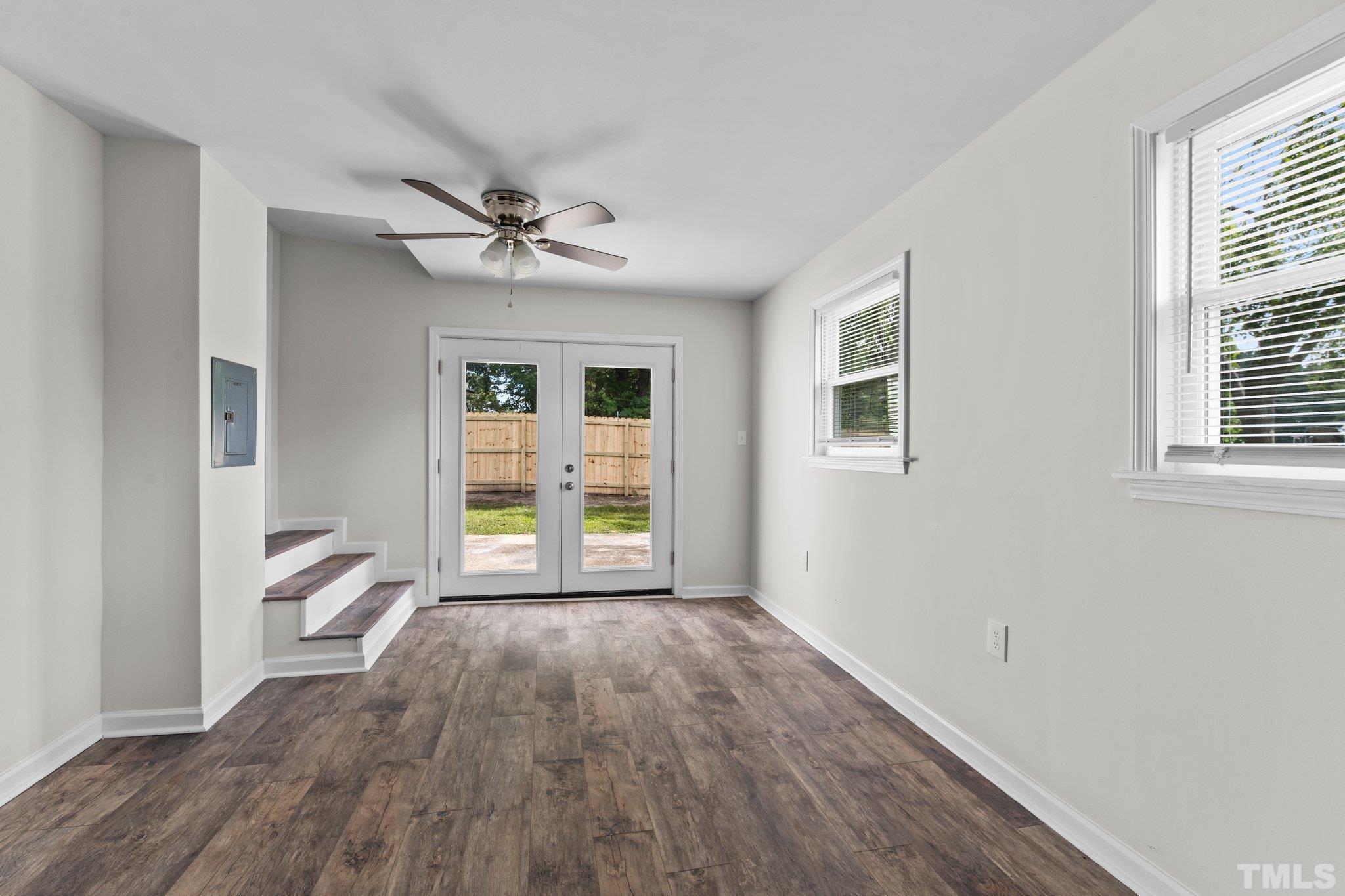 305 West Horton Street Zebulon, NC 27597 - Photo 19 of 29 a view of an empty room with a window and wooden floor