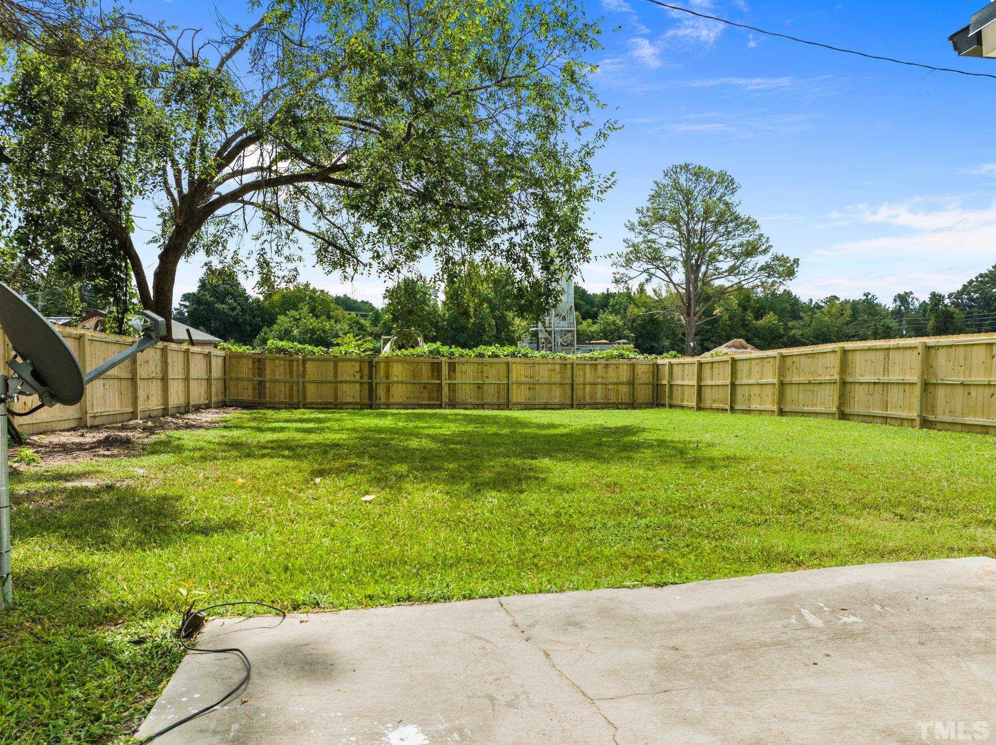 305 West Horton Street Zebulon, NC 27597 - Photo 23 of 29 a view of yard with grass and trees