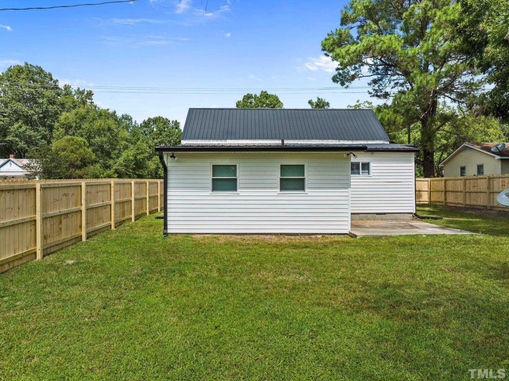305 West Horton Street Zebulon, NC 27597 - Photo 25 of 29 a view of a house with a yard