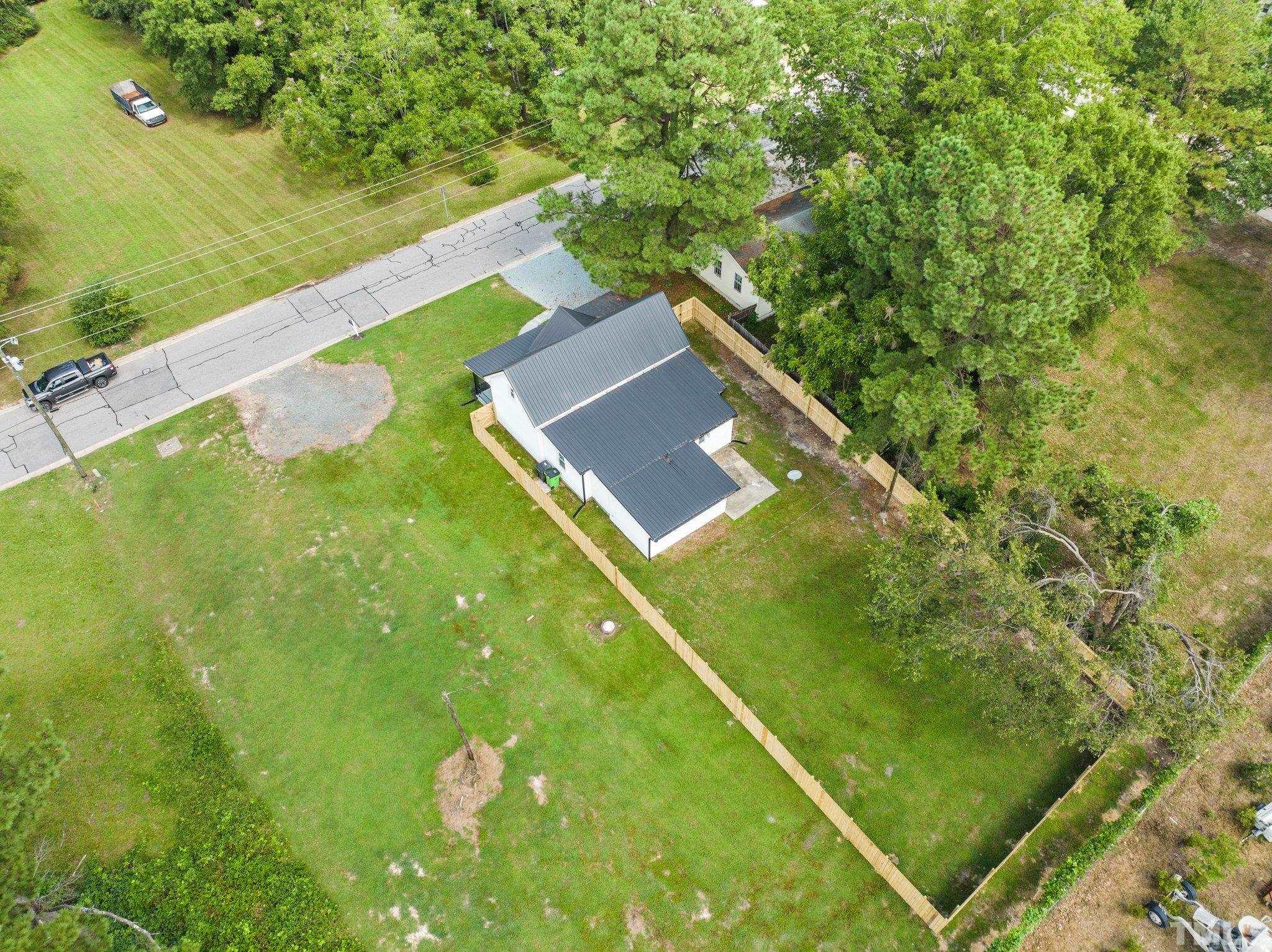 305 West Horton Street Zebulon, NC 27597 - Photo 28 of 29 a view of an outdoor space and a yard
