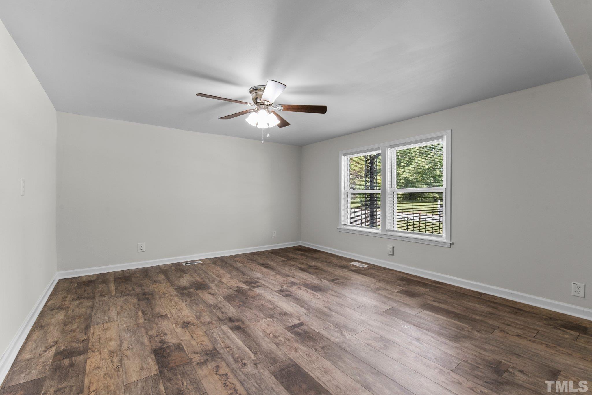 305 West Horton Street Zebulon, NC 27597 - Photo 7 of 29 a view of an empty room with a window