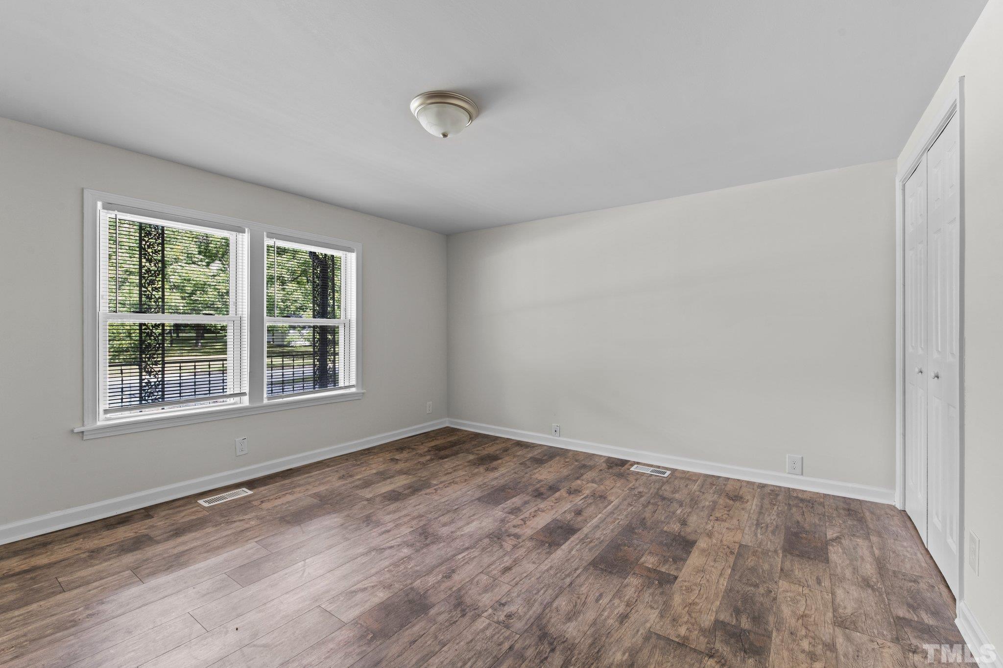 305 West Horton Street Zebulon, NC 27597 - Photo 8 of 29 a view of an empty room with a window