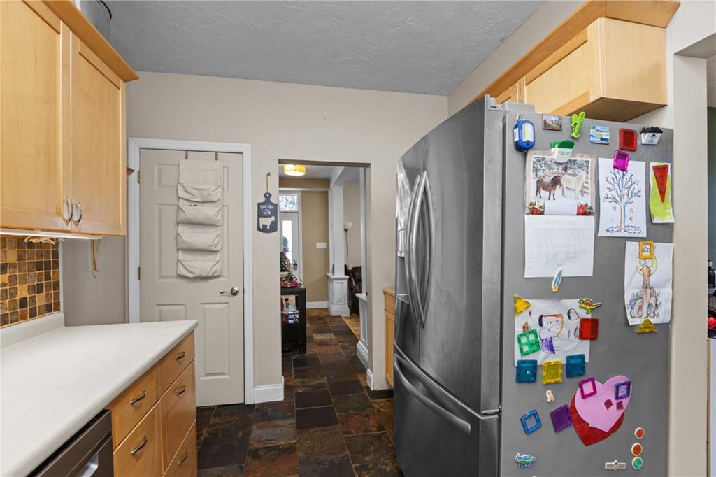 325 East Grant Street Houston, PA 15342 - Photo 12 of 33 a kitchen with stainless steel appliances a refrigerator and a stove