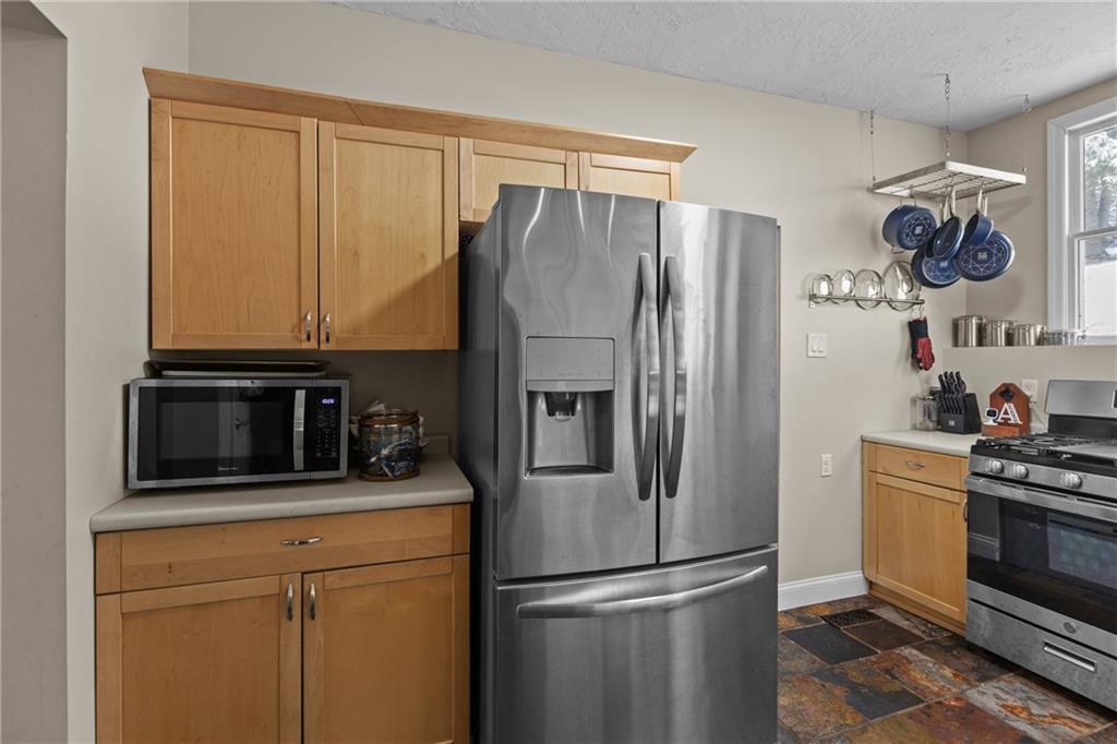 325 East Grant Street Houston, PA 15342 - Photo 14 of 33 a kitchen with stainless steel appliances granite countertop a refrigerator stove and microwave
