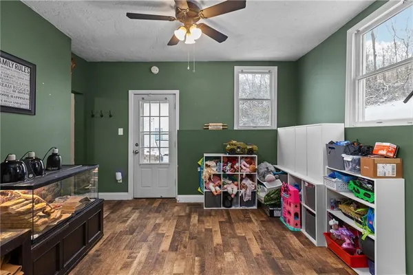 a room with furniture and book shelf